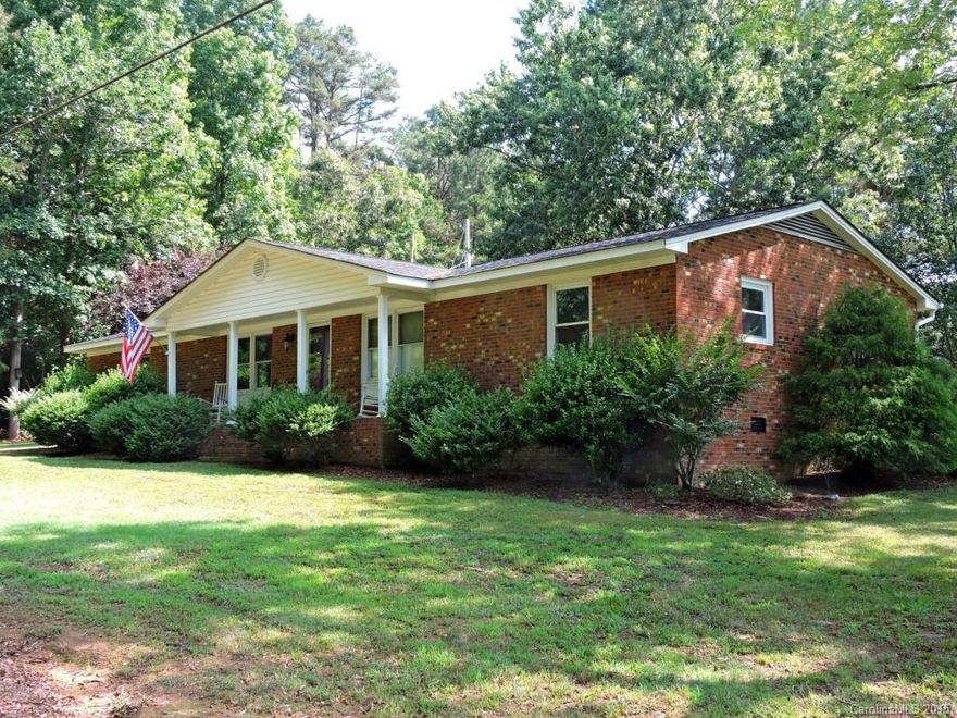 Spacious one-owner brick ranch in desirable North Stanly community, with vinyl trim, replacement windows, updated heat pump/central air, huge 24x24 deck, detached storage/workshop. Wooded corner lot with rear entry driveway gives this home great curb appeal. Quiet country neighborhood with easy access to US-52 and NC-49. Well maintained and competitively priced.
