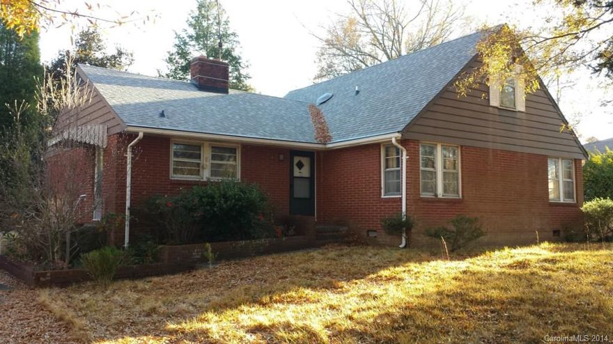 Brick home next to beautiful Granite Park in the town of Granite Quarry.  3 Bedrooms on main floor with 2 full baths plus 2 bedrooms & half bath upstairs.  Some nice built-ins.  Lovely wood flooring throughout most of the house.   Brick fireplace between living & dining rooms.  Detached double carport (just needs a door to make it a garage) plus lean-to carport/storage.  Creek separates property from the park. New roof in 2014.  Great house but needs superficial TLC.