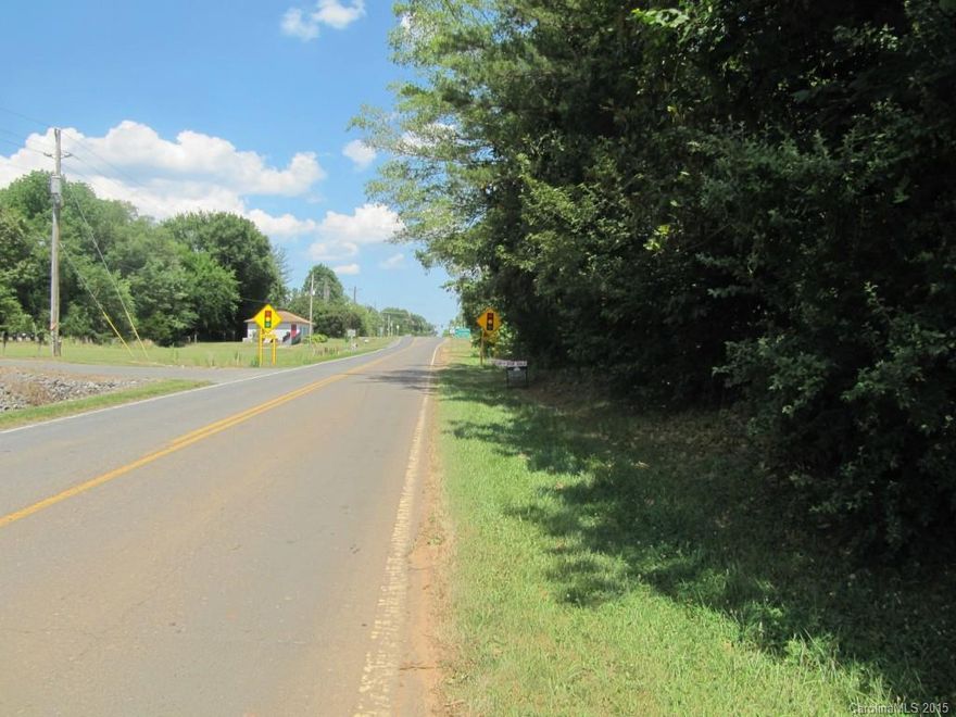 Reduced! Superb commercial development opportunity in convenient and active 5 points area! Potential to combine with neighboring 16 acres for a total of about 28 acres. Zoned BD III (general business). Environmental Impact Study has been completed on the property. Large scale development going on right across the street. House on property is to be sold as is. Property has been valued for land, not the home. Please do not disturb tenant in home. Pond on property. Call LA w/ questions. Thanks!