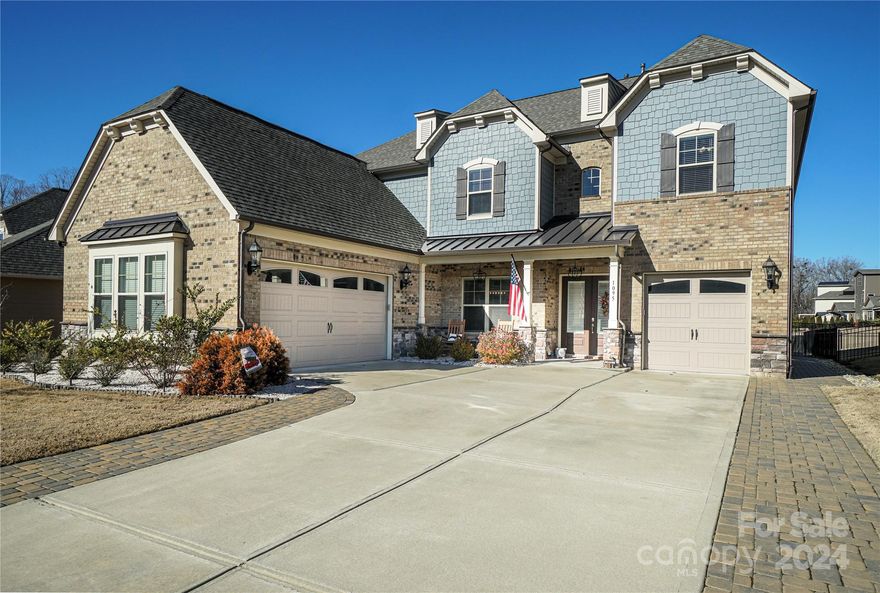 Stunning and luxurious 5 bedroom executive home in Indian Land just minutes from Ballantyne and 485. Built in 2019, this upgraded home has a large suite upstairs with a beautiful ensuite bathroom plus a walk in shower and a garden tub. The spacious dual walk in closet leads to additional attic space for extra storage. There is a Jack and Jill bathroom for 2 bedrooms plus another bedroom and full bath along with a game room upstairs. Downstairs there is a guest suite, a full bathroom, a formal dining room and an open and spacious floorplan with lots of light. The gourmet kitchen has gorgeous cabinetry, upgraded appliances and a 5 burner gas cooktop. The expansive covered porch & patio has almost 500 sq feet of French Pattern Travertine providing lots of room to socialize, grill out and enjoy the pergola and firepit in your fenced in backyard overlooking a natural area & retention pond. There is an oversized 2 car garage plus a separate 1 car garage both with pebble stone floor coating.