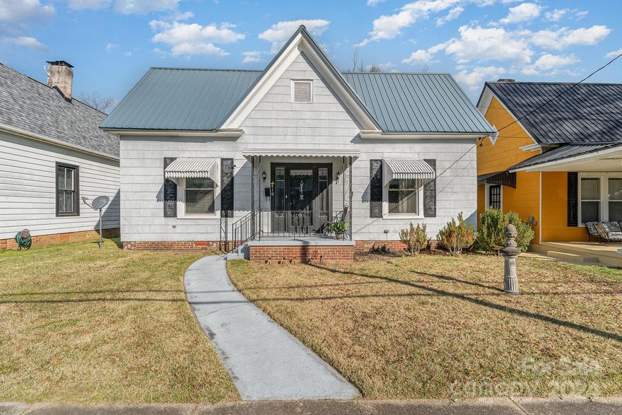 Welcome to this charming 2-bedroom home nestled in Spencer, NC minutes from The North Carolina Transportation Museum. Step inside to discover the timeless elegance of hardwood and laminate flooring.The spacious bedrooms offer sanctuary-like comfort, while the living room beckons for gatherings and relaxation. Indulge in not one but 2 additional living spaces - a family room for cozy movie nights and a quaint sitting room for quiet moments of reflection. The open kitchen, complete with an island, sets the stage for entertaining. Outside, a fenced-in yard awaits for outdoor enjoyment. This is a perfect opportunity for investors, first-time homebuyers, or those with a vision for renovation! This charming ranch home awaits someone ready to unleash its full potential. While it needs repairs and is being sold as-is, it offers the canvas for your creative touch and personalization. With a little TLC, this property can transform into the home of your dreams. One Year Home Warranty included!