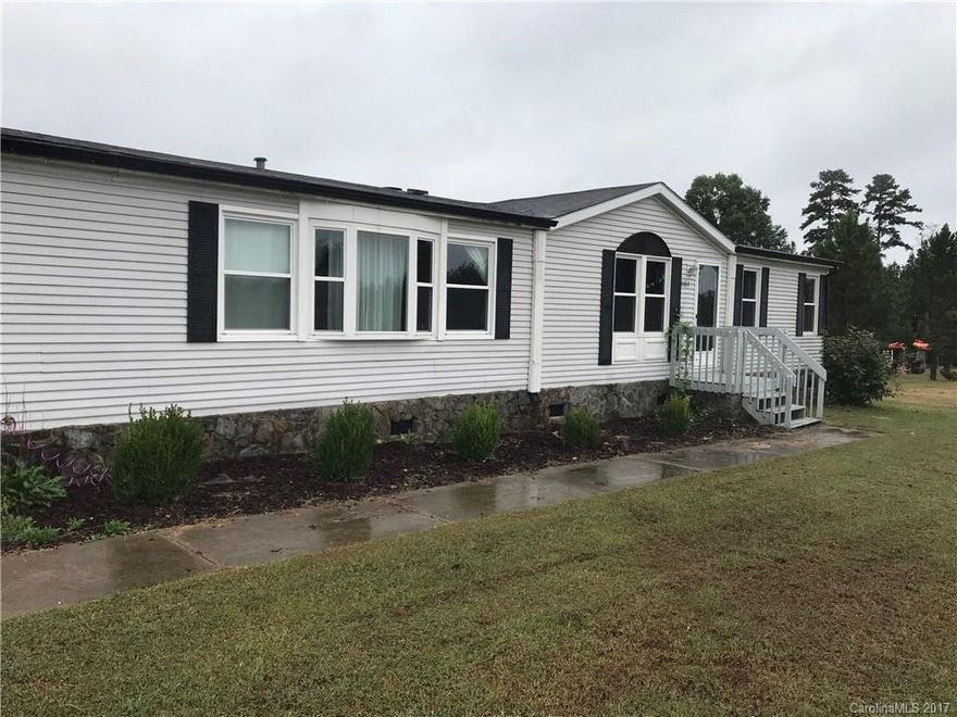 Fantastic home with a Mount Holly address, but no city taxes. Half-acre lot with lovely wooded view in back -- perfect for enjoying this home's spacious deck. Wired and lighted workshop.