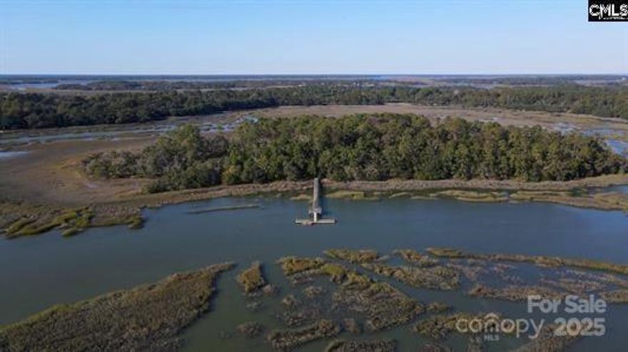 Discover Grangers Retreat Island, an exclusive collection of waterfront lots for sale on a coastal island in Beaufort, South Carolina. (Other available lots include 1, 4, 6, 7, and 8—see plat and pictures for more information.)Accessed by your own private 0.5-acre mainland lot, complete with a large pier and floating dock. This mainland lot property is just steps away from the Wallace Boat Landing. A short boat ride transports you to the island, where you can enjoy a private paradise surrounded by graceful windmill palms, majestic palmetto palms, and classic magnolia trees.The island offers modern amenities, including underground electric and well water, making it an ideal spot for your dream getaway or permanent residence. The private shared pier and floating dock provide easy access to Capers Creek, just moments from the vast open waters. Plus, it’s conveniently located just a quick commute to Highway 21, the charming downtown Beaufort, and the upgraded Beaufort Executive Airport.