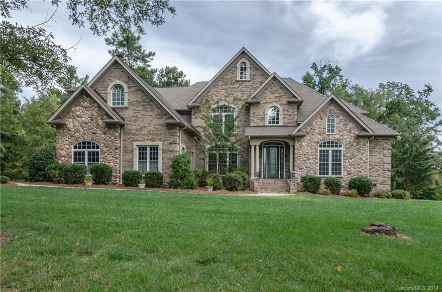 Incredible chance to own stunning home in Lakeside community priced correctly for market. Custom blt w/high-end upgrades. Neu decor, main lev includes mstr suite w/his & hers walk-in closets & sep. sitting area. Kitchen w/island & Stainless Steel appliances. Formal LR & DR, fam room, lib/off & w/2-FPs. Lg bedrooms upstairs along w/2nd mstr suite & lg bonus/media room w/3rd fireplace, sink, refrig. & microwave. Huge scrnd porch, level wooded 1-acre lot provides privacy w/seasonal water views.