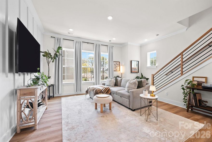 Custom, move-in ready, and tucked into one of Oakhurst’s most convenient locations - this end-unit townhome stands out in all the right ways!

Built just two years ago with thoughtfully selected upgrades throughout, this 3-bedroom, 3.5-bath home offers the elevated finishes, natural light, and low-maintenance lifestyle today’s buyers are searching for. The open-concept main level features 10-foot ceilings, oversized windows, a bright modern kitchen, spacious living and dining areas, and seamless flow ideal for both everyday living and entertaining.

With nearly 1,700 square feet, the thoughtfully designed floor plan includes a private lower-level bedroom or flex space ideal for a home office, guest suite, or gym. Upstairs, the spacious primary suite feels like a true retreat with an en-suite bath and walk-in closet, while an additional secondary bedroom and convenient upper-level laundry complete the top floor.

Positioned on a rare corner + end unit backing to trees, this home offers added privacy and the best setting in the community. Enjoy multiple outdoor living spaces including a rear porch and fenced yard - plus the convenience of a 2-car attached garage.

Located minutes from Plaza Midwood, Cotswold, NoDa, and Uptown Charlotte, this home delivers the perfect blend of modern design, privacy, and city convenience with easy access to dining, shopping, greenways, and entertainment.
