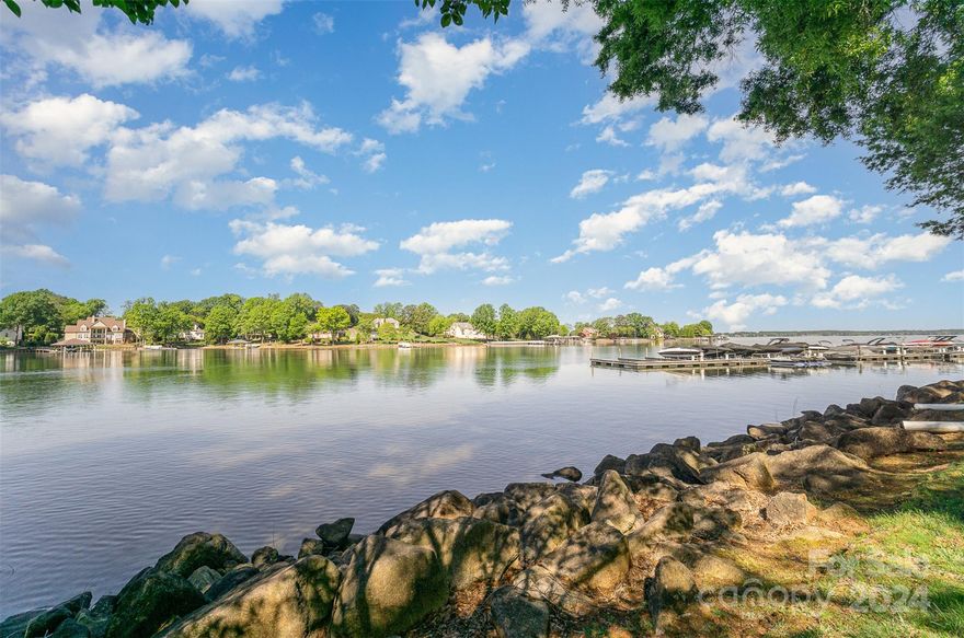 Unique opportunity to own the largest end unit in the coveted lakefront gated community of Pointe Regatta with a private dock and owned (deeded) boat slip. 1 of only 7 waterfront condo units in a single-family neighborhood off popular Cornelius exit 28. Renovated and painted throughout! New kitchen with custom cabinets and quartz countertops with built in bar, 5 burner gas cook top with custom wood hood and new KitchenAid kitchen appliances. Walls opened in kitchen and dining room for unobstructed & stunning views of the Lake Norman.  Large bay window overlooking side yard with privacy from neighbors. Walk-in pantry & drop zone.
New composite deck for low maintenance.  Hard lined gas grill on deck conveys.
New hardwoods throughout upstairs and downstairs.  Large, main level primary bedroom with windows for sunset views. Fully renovated primary bathroom with huge shower, custom double vanities and soaking tub. 2nd floor boasts Cedar Sauna for relaxation. New roof.  Tons of storage!