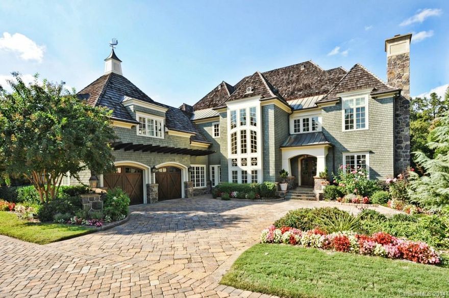 Former Homearama Home!! This High-Tech Smart Home will Astound you! Everywhere you look this home inspires unforgettable entertaining through it's Exquisite Appointments which include Chef's Kitchen with all Viking/Hadco Products, Wine Room, Multiple Living Areas on every floor, Media Room, and Incredible Master Retreat, Glass View Elevator, Many Architectural Features, 3 Terraces, Infinity Pool, Gourmet Outdoor Kitchen, Exercise Room and Sauna, Laundry Rooms on every level, and more!