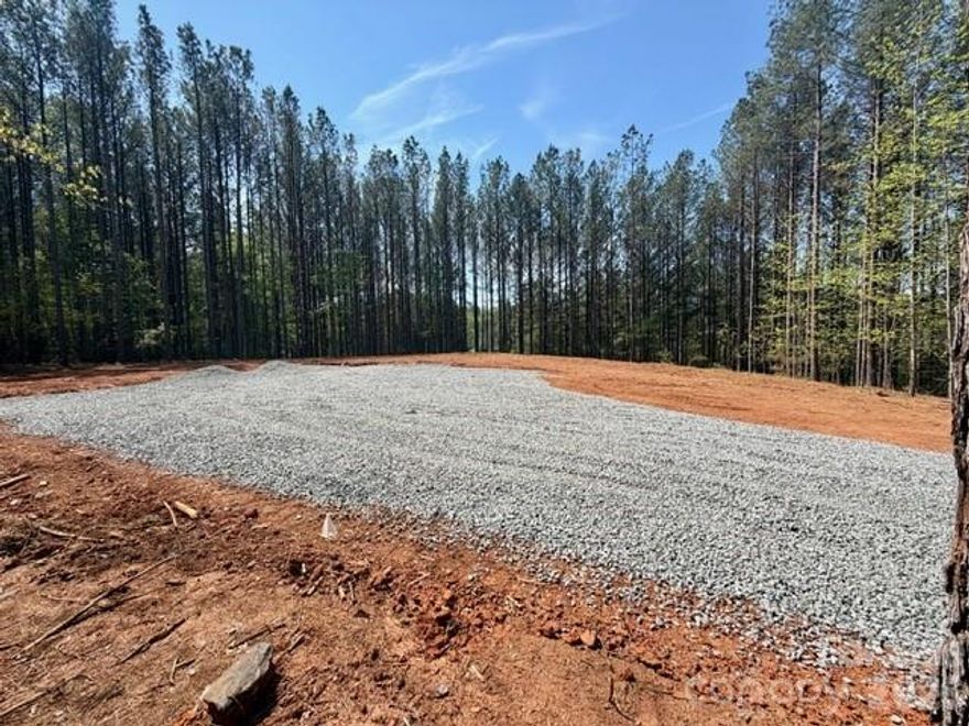 1.54-acre lot in the gated Clearwater Creek community, is ready for your dream home! Property has been cleared for homesite with driveway in place. Well and 3-bedroom septic permit.  Enjoy peaceful country living with convenient access to nearby amenities. Community features common areas offering picnics along the creek, gazebo, pavilion, and playground.