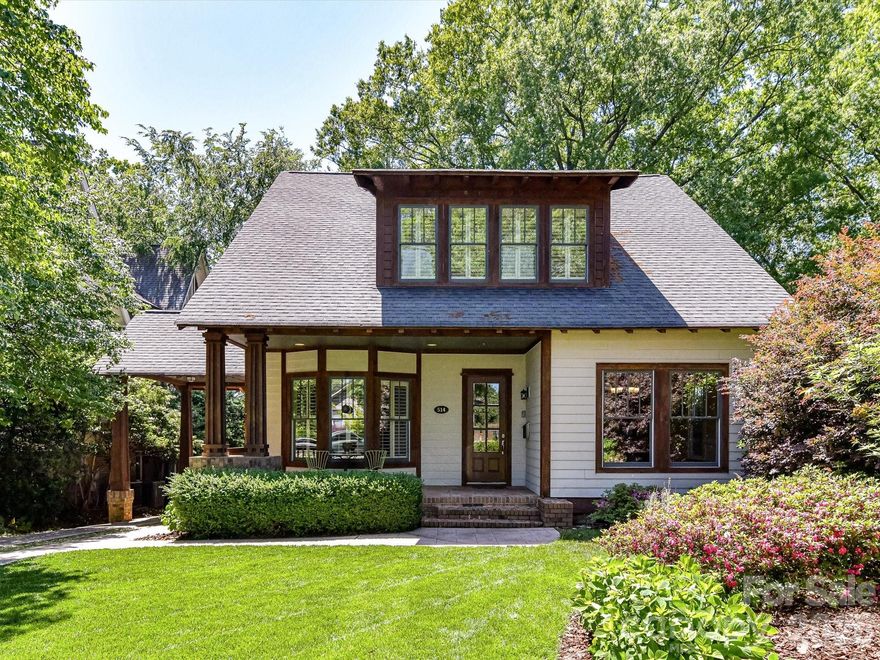 Welcome to a stunning, unique Craftsman-style home on Magnolia Hill: one of Dilworth’s most desirable locations. Step inside to soaring 10' ceilings while the home’s open concept flows seamlessly from the kitchen's gas Wolf/Bosch appliances and massive island (seats 8+) to uninterrupted views across the living area through tall glass French doors to a screened-in back porch overlooking a cozy patio and green space with natural privacy. Features 2 primary suites (up/down) with walk-in closets, ensuite baths, walk-in showers and tubs (Jacuzzi below). Includes smart lighting, thermostats, bath lights/fans, gate and garage; hardwoods (BRs carpet); fenced backyard; irrigation system; Lev2 EV charger; carport leading straight to 10'-high pantry and abundant storage. You have quick access to some of CLT's best groceries, restaurants, parks and community events and are only blocks away from South End’s unique urban energy with its own restaurants, retail and rail trail access. A hilltop gem!