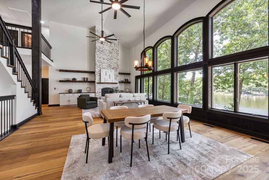 $300K+ in UPGRADES! Beautiful 5600+ htd sq ft (w/extra rooms) waterfront retreat/Gated Harborgate Community/GORGEOUS lake views/22 ft+ great room ceilings w/ floor to ceiling windows/NEW brick veneer fireplace/NEW engineered oak flooring/NEW stair railing/columns/aluminum balusters/NEW Laundry room cabinets, butcher block countertops, tile wall, sink/NEW washer/dryer/dishwasher/NEW upstairs bathroom with COPPER tub and custom shower/NEW upstairs geo-thermal unit/All NEW window trim & baseboards/Painted all rooms & ceilings/Bottom Level - NEW LVP/NEW baseboards/NEW Anderson ceiling planks/NEW cabinets backsplash/NEW golf mat/Retractable screen for MOVIES or Golf Simulator(not included)/New remodeled bath w/custom sink/NEW In-ceiling Dolby Atmos 5.1/NEW aluminum fence/NEW landscaping/NEW irrigation lake pump permit/Community pool/tennis courts/club house/community dock/boat ramp/boat storage & playground/Hard coat stucco with rock veneered accents/17+/- ft deep end of dock at full pond!