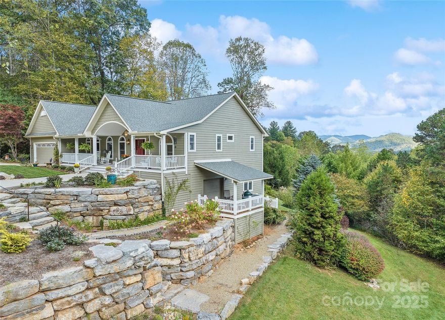 This luxurious home has elegance, practicality, and stunning views in Waynesville! Located in desirable Iron Duff, where you'll be approximately 25 miles from Asheville and very close to the Tennessee border. If you weren't completely awed by the incredible landscaping on the way in, be prepared for the wow factor as soon as you open the front door. You'll experience ceiling beams and a rock fireplace, welcoming you as you enjoy the rear mountain views. Tons of upgrades and incredible features, like the hot tub on the rock patio with an impeccable view. Warm up by the rock fire pit this fall! Listing agent is related to sellers.