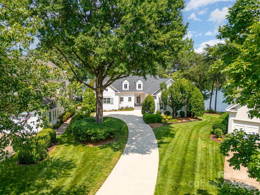 Welcome to the Lake! The cul-de-sac location with expansive water views, 123' of shoreline, private dock and boat slip create the quintessential lake cottage setting. Completely renovated, beautifully designed kitchen, 6 burner gas range, beverage fridge, tiled wall, Quartz counters and plenty of drawer storage. Vaulted ceilings enhance the fireplace surrounded by new windows and a 180 degree water views. Main level features open plan with great room, dining, kitchen, owners suite with dual marble vanity, soaking tub, spacious shower and a custom closet.The guest bedroom and bath, laundry room and waterfront office with deck complete the first floor living area. The lower lake living area consist of great room, guest bedroom and full bath. Upper, lower decks and patio are perfect for outdoor entertainment. Peninsula Club just across the lake!