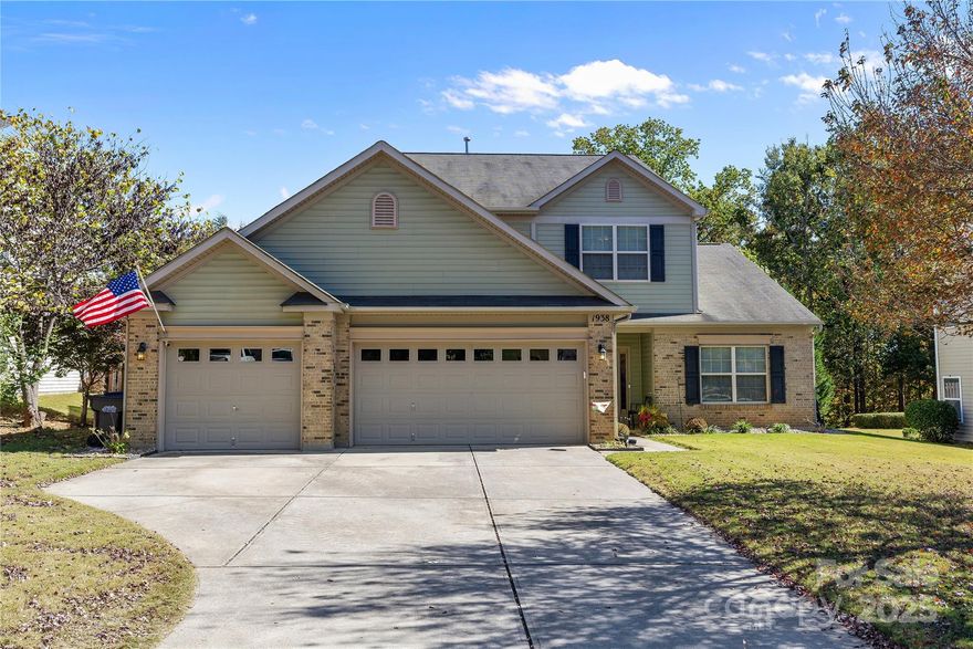 Welcome to 1938 Caprington Drive — a beautifully maintained & thoughtfully designed 4-bedroom, 2.5-bath home located in the highly desirable Almond Glen community just minutes from Ballantyne & Fort Mill. This inviting residence offers an ideal blend of style, function, and comfort. A welcoming front entry leads into a bright, open floor plan highlighted by rich hardwood flooring throughout the main level and abundant natural light. The spacious 2-story great room flows seamlessly into the kitchen and dining areas, creating an effortless layout for entertaining and everyday living. The well-appointed kitchen features granite countertops, stainless-steel appliances, a center island with seating, tile backsplash, gas cooktop and ample cabinet space. A cozy breakfast area overlooks the backyard and opens to the deck — perfect for morning coffee or weekend cookouts. The main-floor primary suite provides the perfect retreat, offering privacy and convenience with its large walk-in closet and spa-inspired ensuite bath featuring dual vanities, garden soaking tub, and a separate shower. Upstairs you’ll find 3 additional spacious bedrooms, a full bath, and a flexible loft area that can serve as a home office, media room, or play space. Step outside to enjoy a private, tree-lined backyard with a raised deck and patio area — ideal for relaxing or hosting gatherings. The home sits on a beautifully landscaped lot and includes a rare 3-car garage, providing ample room for vehicles, storage, or workshop space. Plus, a New Sept. 2025 HVAC Unit. Almond Glen residents enjoy access to community amenities including an outdoor pool plus low HOA dues. The neighborhood’s prime location provides easy access to top-rated Lancaster County schools, nearby shopping and dining, and quick connectivity to I-485, Ballantyne, Blakeney, and South Charlotte. Do Not Miss The Opportunity To Own This Exceptional Home In A Prime Location.  Do NOT Wait On This One – Bring Your Offer Today! Priced Right For Quick Sale.