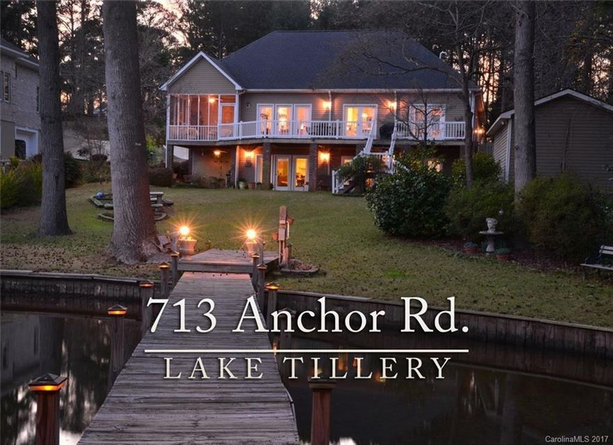 Stunning Lake home ready for the Summer Season.Beautiful large water views from any room.  4 bedroom, 3 baths, formal and casual living, lower level is complete second living quarters. Upper full deck and lower full patio.  Screened porch too. One bay boathouse with large bar and storage and a sun deck sure to please.  Good water at pier, gradual from seawall for the kids.  Near Golf, pool, park, 2000 ac. equestrian facility, shopping, dining, medical and more.  Come take a look. Enjoy the Lake!