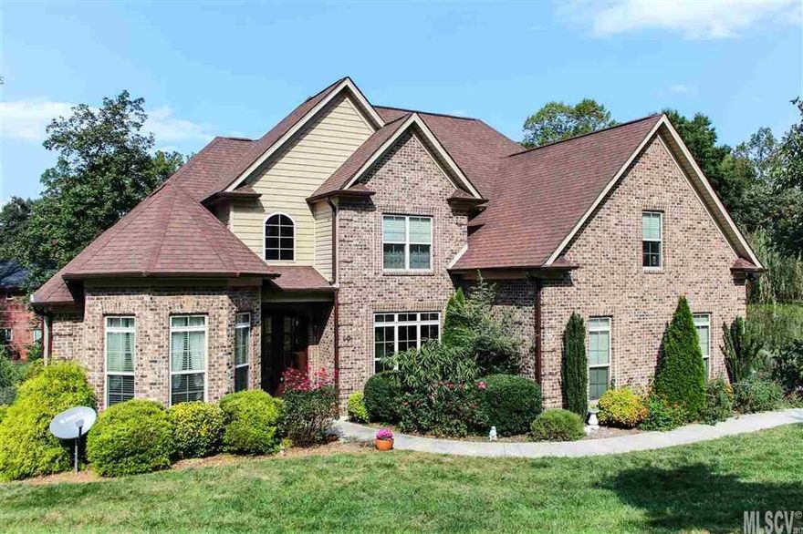 Be the Ultimate Host in a home tailored for stylish living and elegant entertaining! The Joys of entertaining belong to you in the 5 bedroom 4 bath all brick custom built home with over 4000 sq ft located in NW Hickory.  Enjoy gourmet cooking in it's elegant, sun filled kitchen w/custom cabinetry, stainless appliances & expansive center-island with plenty of granite counter space for everyone. Relax by the fire in the open great room or retire to the main level master with over-sized soaking tub. With gleaming hardwoods, high ceilings and generous room sizes this home reflects excellence. Offering an office or 2nd bedroom on the main, 2 additional with bonus on second level and separate living quarters with full kitchen in the basement, there is room for everyone!