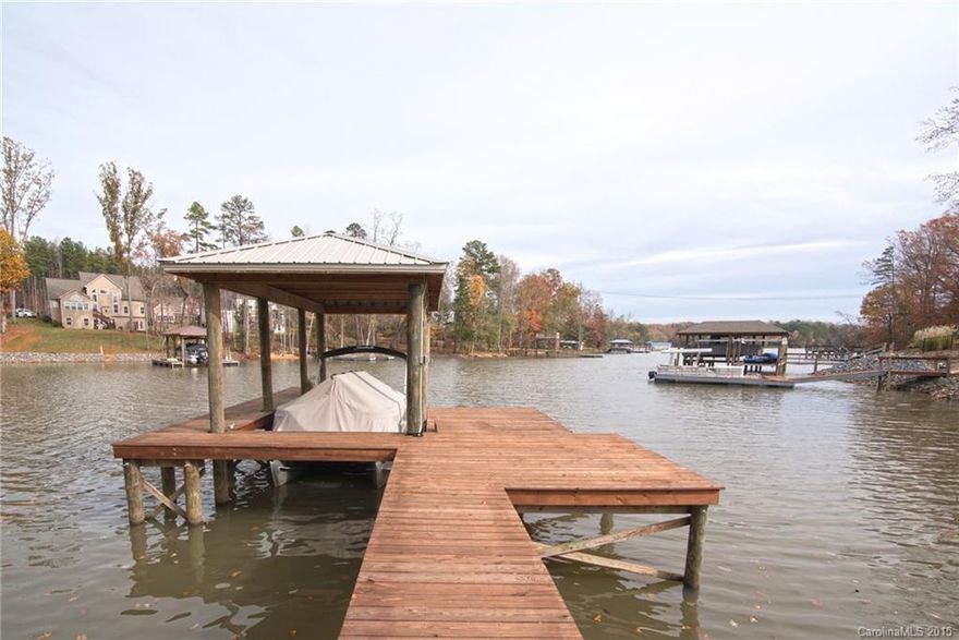 Pure luxury waterfront home w/private deep water pier & floating dock! Beautiful lake views combined w/exquisite finishes make this home a show stopper!5 inch white oak floors & triple crown molding thru-out main level.Amazing ceiling details in every room including vaults,tray ceilings & cove lighting.Kitchen features large island,walk in pantry & Electrolux appliance package w/6 burner commercial grade oven.Spa Master Bath!Spacious walk out basement w/kitchenette!338 SF workshop!