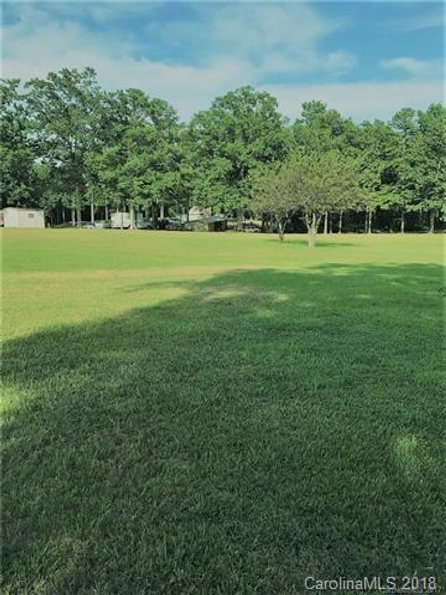 1.75 acres of cleared land located on the Indian Land/Lancaster Line. Located about 1 mile from back entrance of Sun City, additional 1 wooded acre available in back is also for sale at an additional price,. Land is L-shaped.  10 miles from 485 n Ballantyne, close to shopping.