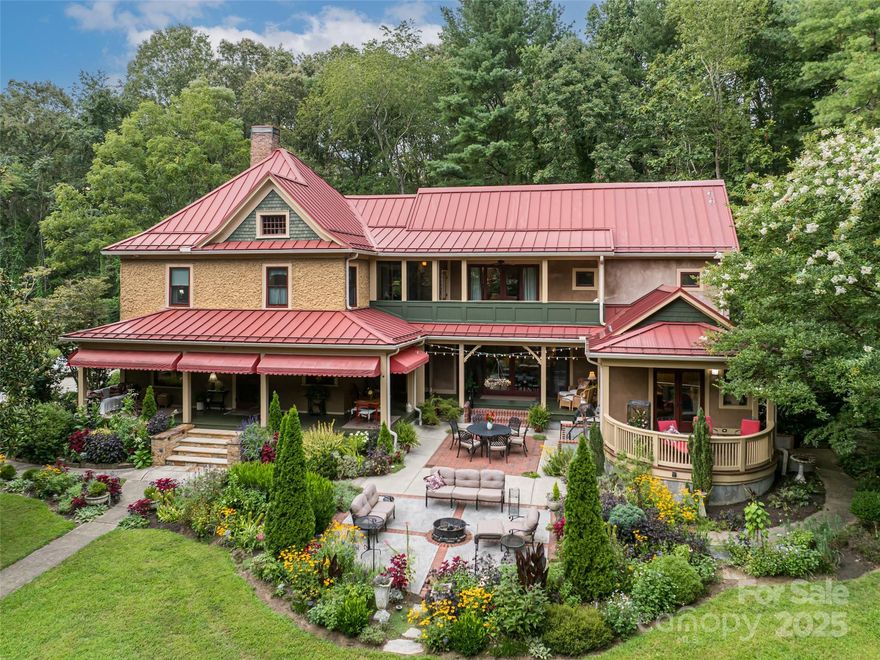 OPEN SUNDAY, APRIL 19, 2-4 PM! Unique Opportunity for large home and developable property in highly desirable 5 Points neighborhood, walkable to Downtown and greenways. Potential for medium density residential development, zoned RS8.  This rare in-town parcel, offers multiple paths for value: subdivide for cottages, or a few higher-end homes, or an enclave (subdivision registered with city, BUYER to verify).  Additional lot zoned NCD (same owners) may be sold separately or as a package.   The existing home, lovingly restored by current owners, features high ceilings, heart pine floors, wood burning fireplace in kitchen with 5 additional tile-front fireplaces. Beautiful period details throughout.  Wraparound front porch that opens to a courtyard and large 2012 addition of family room and 2 bedrooms, including large primary suite.  Lush landscaping and gardens abound.  Legal Homestay on main level grosses over $25,000 annually.  Parcel below on Broadway (NCD zoning -same owner) and can be sold separately or as a package (call for info). Shop lot to left of driveway (Min. 1/4 acre) included with this listing but may be purchased without lot (see MLS 4299259). Currently working w/City to rezone lot to RS8. Seller to retain shop use for up to 1 year.