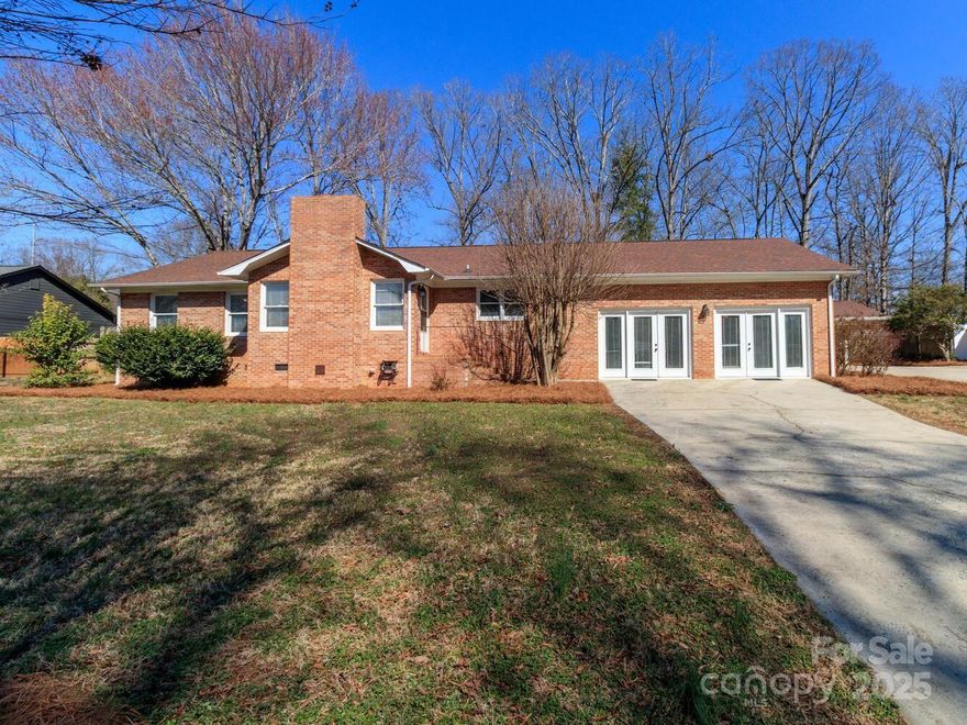 This 3-bedroom,3 bath all brick ranch is full of potential! Located just minutes from quaint downtown Monroe, it offers the perfect blend of convenience and charm. The beautifully upgraded kitchen features a Sub-zero refrigerator, granite countertops, island, eat-at-bar area AND ample cabinet space. The open floor plan creates a spacious and inviting atmosphere, centered around a cozy fireplace-perfect for relaxing or entertaining. Step outside to enjoy the fenced yard, offering privacy and security, along with a dedicated pet kennel- a great feature for pet owners. The property also includes TWO storage sheds, zoned for storage but offering multiple possibilities-convert them into a man cave, workshop or hobby space. Bonus room conversion (~506 square feet) is included in total sq. feet but is not permitted. House and shed are sold AS IS.