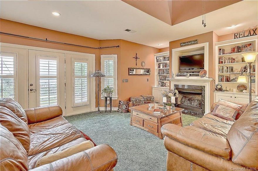 WOW..what an amazing home! Beautiful half acre lot. Screened porch overlooking the pool. Step into this home and find an open floor plan, perfect for entertaining. Large owner's retreat. large Pool level Bonus Room (additional 910 SF heated) with Kitchen, full bathroom & huge pantry/storage.  Meticulously landscaped yard, beautiful Lake view. Don't miss this opportunity!!