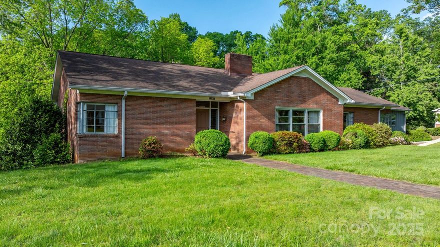 Welcome to 220 Broad Street—a well-kept 3-bedroom, 2 1/2-bath home on 1 acre in a quiet neighborhood just minutes from a vibrant downtown Marion, NC.

With 2,754 sq feet on the main level and 2,507 sq feet in the basement, this home offers plenty of space for you to relax, entertain, and expand. The large kitchen has abundant cabinets and flows into a breakfast area and formal dining room.

Hardwood floors run throughout, and all bedrooms are generously sized. There’s no shortage of storage, with a 2-car garage, unfinished basement and a cedar closet.

The warm, wood-paneled den opens to a sunroom and deck overlooking a gently sloping yard that leads to a peaceful creek. Mature blueberry bushes add to the charm.

The basement includes a bathroom, laundry area, and space for a workshop or future additions. 

This home offers the best of both worlds: private, peaceful living with quick access to shops, restaurants, and downtown events.
