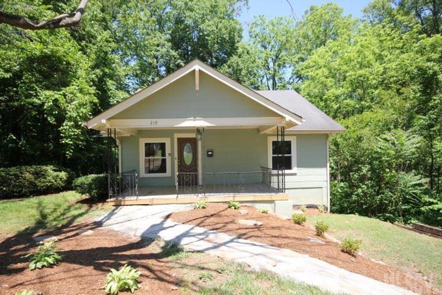 MOTIVATED SELLERS - LOTS OF SF IN THIS HOUSE! This beautifully restored home is conveniently located to downtown Lenoir. It has an open floor plan with a large living room, fireplace and hardwood floors that continue into the over-sized dining room! The kitchen allows ample room for meal prep and includes a bar that would easily accommodate several bar stools for casual dining. Improvements include replacement windows, remodeled the existing bath, added a second bath and a laundry area on main floor, new wiring, plumbing, hardwoods, fireplace and a security system! The house has been painted inside and out, has a basement that allows for plenty of dry storage on a concrete slab with additional storage space on a vapor barrier. This home includes an extra lot for additional privacy!