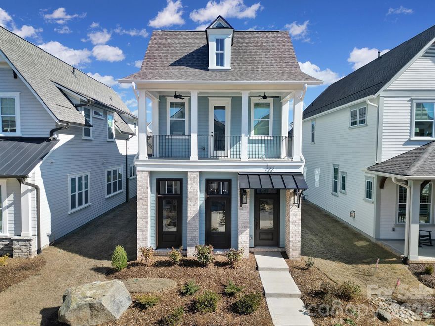 This Southern Charmer is located in the heart of Springfield Town Center, where everyday convenience meets an easy, walkable lifestyle near local shops, restaurants, and Harris Teeter. Inside, the main level offers open, comfortable living with a welcoming family room that flows into a beautifully designed kitchen featuring a large center island—ideal for both daily living and casual entertaining. The primary suite on the main level tucked at the rear of the home with easy access to the covered back porch. Upstairs, you’ll find three generously sized bedrooms with walk-in closets, two full baths, and an unfinished flex space for easy access storage, or finish it out for a perfect home office or bonus room. Just off the 3rd BR/Bonus step onto the front balcony classic southern style haint blue ceilings—an inviting spot to enjoy a glass of sweet tea while overlooking the community. This beautiful home is just in time to enjoy the community garden and dog park this Spring! Reach out to tour this brand-new home in Fort Mill with timeless appeal and thoughtful design throughout.