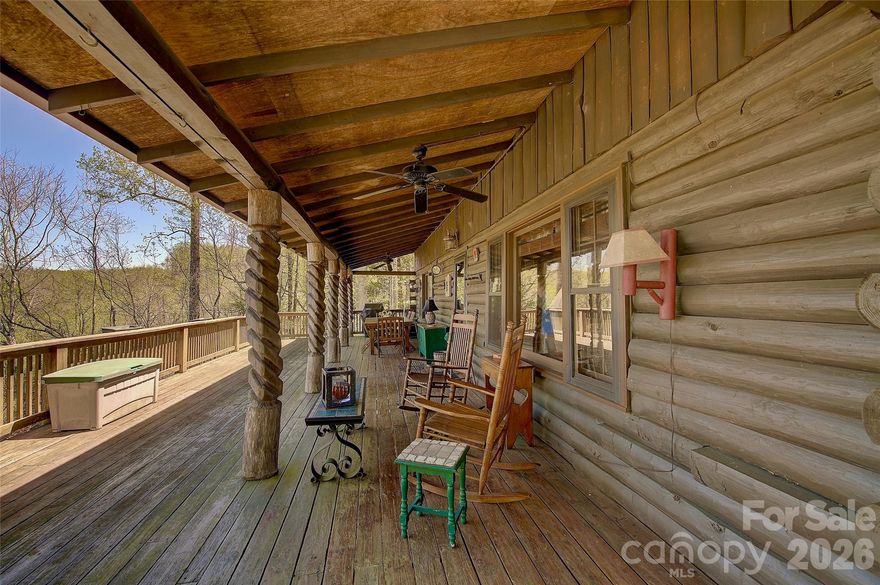 One of the best views imaginable in a cozy custom log cabin at the top of the world in Little Switzerland!  This is mountain living done right! The 2-bedroom/2-bath mountain home delivers when it comes to comfort, location, and one of the best panoramic long-range views to be had (becoming more and more scarce), from the Roan Mountain to the Unalaska, and a side view of Mt. Mitchell and the Blacks. 
Turn-key home, ready for your family and entertainment. The home features oak hardwood floor and beautiful built-ins, rustic nostalgia and modern convenience— the large windows with custom blinds perfectly frame the best views one could ever acquire. ??Community water supplies the home, and an ADT alarm systems offers peace of mind when away.  The home comes mostly furnished, and the full basement, plumbed for expansion, is ready to be finished out providing more bedrooms and doubling the square footage. 
The entertainment/view deck measures in at 40ft. X 16ft. providing the perfect spot to take in the ever changing layers of blue ridge lines, blooming laurel and rhododendron along with numerous other native flora— this is peace that you didn’t know you needed until you step foot onto this platform.  Supported the covered deck are posts designed by a local artist from the world renowned Penland School of Crafts.  There is a a custom-built dining table on this deck that will come in very handy for entertaining family and guests breakfast through supper. 
Enjoy a low-maintenance yard with nice landscaping.  There is plenty of room for gardening and places for the children and pets to run. The circle drive provides ample room for parking. 
This isn’t just a home— it’s a sanctuary.  A place where you can plant and allow your roots to run deep.  This is your opportunity to become a part of these ancient mountains and enjoy the lifestyle that so many have chosen for over 250 years. 
The home offers privacy without remoteness and convenience without the crowd.  Downtown Little Switzerland is just minutes away offering fine and quality dining experiences as the Chalet and at the Switzerland Cafe— here you will be able to mingle with many folks of like background and mix it up with all the latest happenings in this small colony at the top of the world. 
IF YOU APPRECIATE magnificent ancient mountain scenery and like to live or vacation clean and pure— where you can enjoy, but avoid most of the annoyances of urban, suburban or commercialized resort areas, this this property is awaiting your legacy.
The emphasis here is on the enjoyment of one of the most beautiful mountain regions in the entire world; on simple forms of outdoor recreation; on clean mountain living; on companionship with interesting people, and small town schools and sports— as well as complete privacy when desired.
Little Switzerland and the Spruce Pine area are approximately mid-way between New York and Florida, and is easily one days drive from 60% of the entire US population— New York, Philadelphia, Washington D.C., New England, Florida and the Mid-west.
This ridge top awaits your legacy— your family’s crest or shingle is ready to be erected here in this small town enclave.
You are just 5 minutes away from downtown Little Switzerland, 15 minutes away from downtown Spruce Pine and The Grassy Creek Golf and Country Club, and the Blue Ridge Regional Hospital; 5 minutes to the Blue Ridge Parkway; 20 minutes aways from the famous Penland School of Crafts; You will be 30 minutes to downtown Burnsville, or 40 minutes to fine dining, ski resorts and other entertainment at Banner Elk, Beach Mountain, and Sugar Mountain, as well as Mountain Glen Golf Course in Newland; 30 minutes to Lake James, Marion, and I-40; 60 minutes to Asheville, NC; 70 minutes to Johnson City, TN, and the Tri-Cities Airport. This community is two hours from Charlotte, NC.
