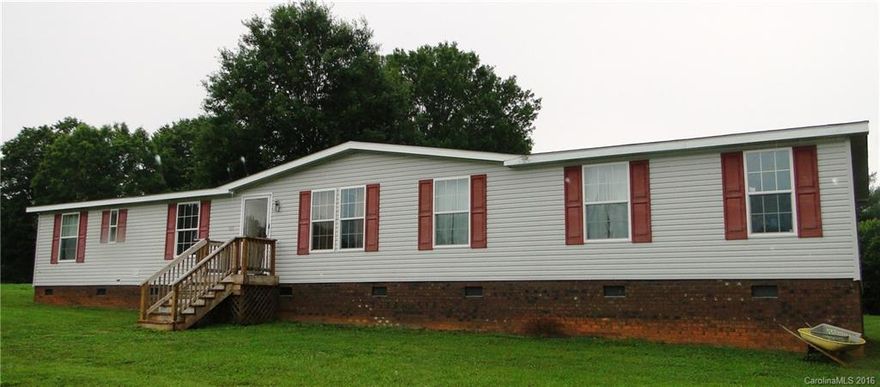 Beautiful serene setting. You will find plenty of room to grow with this 4 bedroom 2 bath home, great room and living room.  Outbuilding