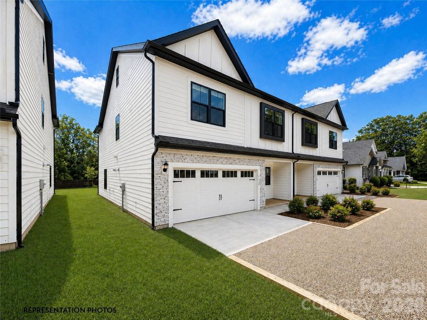 In the heart of the highly desirable Cotswold area of Charlotte with desired schools.  This beautifully appointed duet-style home offers the space and feels like a single-family residence without the single-family price tag and with NO HOA dues. Thoughtfully crafted by SouthCraft by EMPIRE HOMES, every detail reflects intentional design and elevated finishes that make everyday living feel refined.Step inside to discover a bright, open floor plan designed for both functionality and luxury. The kitchen serves as the heart of the home, seamlessly overlooking the dining and living areas, making it ideal for gathering and entertaining. A stunning waterfall Carrara quartz island anchors the space, complemented by 42” cabinetry with soft-close drawers, wide plank flooring, a gas range, microwave drawer, designer hood, and dishwasher. A custom wood-shelved corner pantry. An extended beverage bar add thoughtful convenience, perfect for hosting, setting up a coffee station, or grabbing a quick energy/hydration drink on your way out the door.Nine-foot ceilings on both floors create an airy, expansive feel, while high-end molding adds architectural depth and sophistication throughout. Just off the dining area, an extended sunroom fills the home with natural light and opens to a spacious deck complete with a gas stub line so you’ll never worry about running out of propane before guests arrive.Upstairs, all bedrooms are generously sized and thoughtfully positioned for privacy. The primary suite feels like a true retreat, featuring a custom wood-shelved closet system designed for both beauty and organization.   A tankless water heater ensures you’ll never run out of hot water, enhancing comfort and efficiency. Architectural shingles and Low-E windows further elevate the home’s quality and energy efficiency.Outside, the backyard offers endless potential. Whether you envision a custom entertaining patio, a future pool, lush landscaping, or a private outdoor sanctuary, the deep, level yard provides the perfect canvas.This is more than a home, it’s an opportunity to enjoy luxury finishes, modern functionality, and exceptional value in one of Charlotte’s most sought-after neighborhoods. Photos are representation and show the interior finishes. Some photos were AI enhanced.