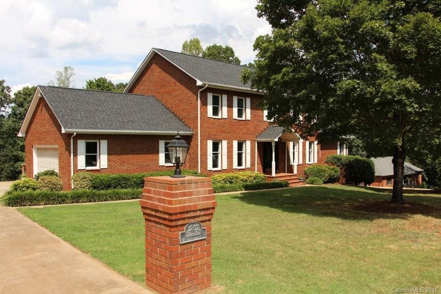 4 BR, 2 ½ BA & on over 1 acre lot. A large, welcoming foyer features beautiful bannister stairway. LR has 9 ft+ ceilings w/wood burning FP. Kitchen w/island, pantry, laundry room, computer desk, & some SS appliances. Formal DR & computer room/den. MBR has dbl, walk-in closets, hardwoods, & MBA w/double vanity sinks & separate jetted tub/shower. BRs 2, 3, 4, & 2nd full BA are located on 2nd level, which overlooks the LR. A screened-in porch & back deck accessible by kitchen, living room & MBR