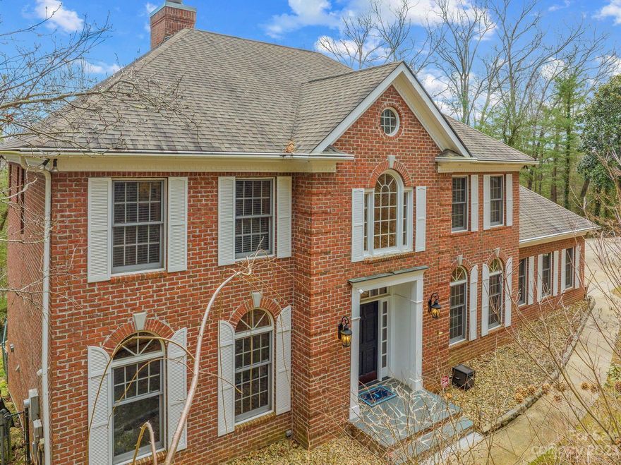 Classic and contemporary collide with this spacious brick beauty located in desirable Glen Arden Heights! Natural light floods the open-concept living area with plantation shutters adorning the windows. The beautifully updated kitchen features chiseled granite countertops, Viking gas range with pop-up downdraft vent, storage galore, and high-quality stainless appliances. This home includes two large primary bedrooms with en suite bathrooms. In addition to the four sizeable listed bedrooms, there are multiple large bonus rooms. The partially-finished walk-out basement would make an ideal in-law suite or income-producing separate living space. The fully fenced-in yard provides a safe and secure space to explore freely, a hot tub to soak in the long-range views, and expansive tiered beds for the gardening enthusiast. There is a two-car garage and ample parking for guests. Don't miss out on this incredible opportunity in a welcoming, established neighborhood with no HOA!
