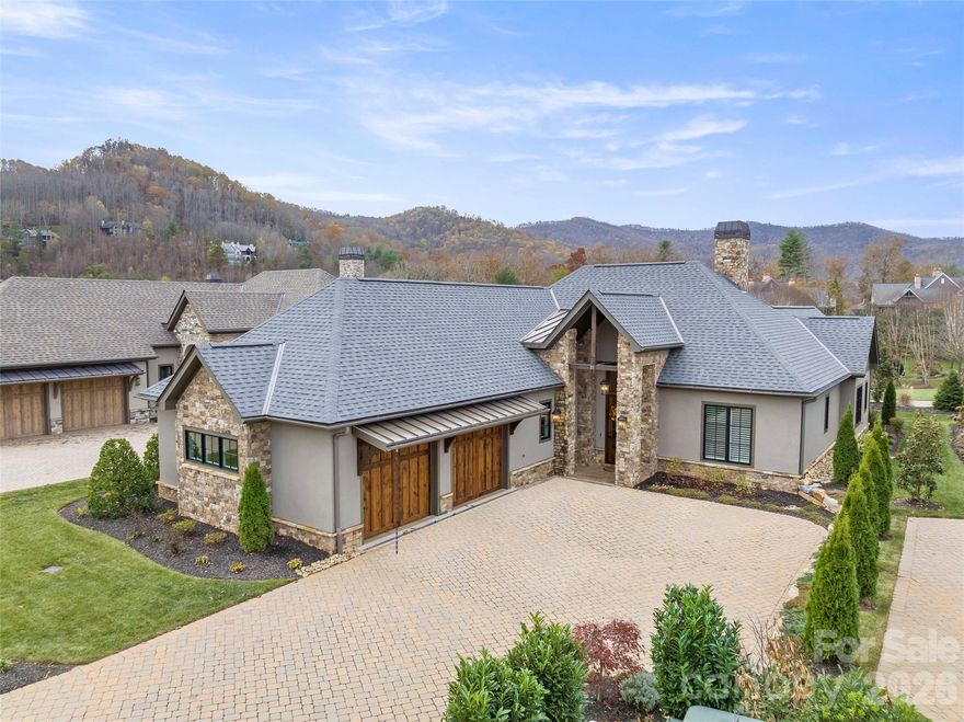 Experience the ultimate blend of luxury and convenience at 11 Haverhill Way, a stunning one-story residence built in 2022. Nestled in the exclusive Meadow View enclave of The Cliffs at Walnut Cove, this 2,313-square-foot home is designed for effortless living with an expansive, light-filled open floor plan. The gourmet kitchen serves as a central hub for social entertaining, featuring a large preparation island, sleek white cabinetry, elegant quartz countertops, and a high-end suite of appliances including a double oven and gas range. Adjacent to the kitchen, the inviting living area is anchored by a cozy fireplace and floor-to-ceiling windows that frame breathtaking year-round views of the surrounding mountain landscape. 

The master suite offers a private, spa-like retreat complete with a soaking tub, walk-in closet, and heated tile floors in the bathroom for added comfort. Two additional ensuite bedrooms provide plenty of space for family or guests, while a formal dining area and a gracious recreation room offer versatile settings for hosting or relaxation. This home seamlessly connects indoor and outdoor living with a screened porch and a large patio that includes an outdoor kitchen, all situated on a level 0.29-acre lot with professional landscaping and included year-round lawn maintenance. 

Living at The Cliffs at Walnut Cove places you within a premier gated community just minutes from downtown Asheville and the Asheville Regional Airport. Residents enjoy world-class amenities including a Jack Nicklaus Signature Golf Course, an 18,000-square-foot wellness center with indoor and outdoor pools, tennis courts, and miles of private hiking trails bordering the Pisgah National Forest. A club membership is available with this property, granting reciprocal access to the extraordinary amenities across all seven Cliffs communities—encompassing seven award-winning golf courses, diverse dining experiences, a full-service marina on Lake Keowee, and an equestrian center.