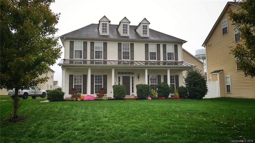 Close to I-77, Ballantyne area and top rated schools.  Well manicured yard & charming front porch await you! Walk into a 2 story foyer, which opens up to flex space. Spacious kitchen open to family room.  Side load finished garage  w/ cable, cabinets, fenced yard, intercom system & central vac.  Beautiful floating laminate wide plank floors on main. Extra storage: 2 linen closets, additional floor added to attic. Inviting master suite w/rustic accent wall, 2 closets & new tile in master bath.