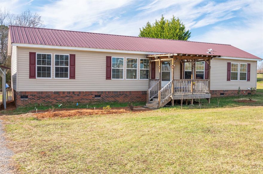 Four bedroom home located in a cul-de-sac with fenced yard and 2 car carport.  Large kitchen; den with fireplace; split bedrooms; 2 covered decks and outbuilding.