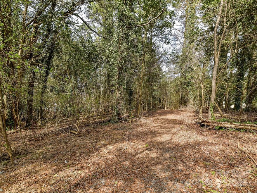 Rare 2.456 acre lot in the city limits on exclusive Huntington Park Drive is awaiting your new custom dream home.  Wooded and private, the possibilities are endless.  Located just minutes to South Park, dining, shopping, businesses, yet private as can be.  The property has not been cleared.