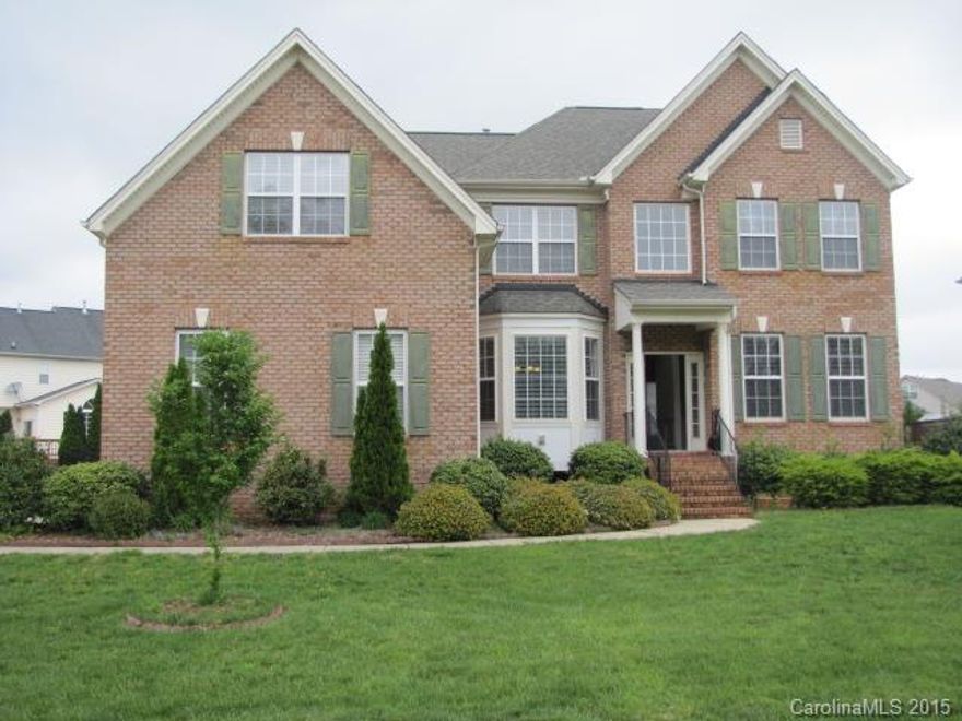 Beautiful brick-front home in desirable Matthews accented by hardwoods, heavy crown molding and wainscoting. Formal living and dining, 1st-floor office w/bay window, family room w/fireplace, large bonus up. Kitchen has breakfast bar island, granite counters, SS appliances, gas cooking, double oven, ceramic tile backsplash. Breakfast room has vaulted ceilings and access to rear deck. Master retreat w/sitting area, bath w/dual sink vanity, garden tub, tiled shower.