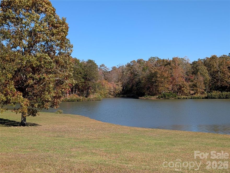 Discover the opportunity to build your dream home in the prestigious gated equestrian community of Derbyshire in beautiful Polk County, North Carolina. This exceptional lakefront lot offers approximately 100 feet of shoreline, providing peaceful water views and the perfect setting for a custom mountain retreat.

Located beside an existing luxury home currently offered for sale, this parcel may be purchased separately or combined with the adjoining home and additional lot for those seeking a larger estate setting with added privacy and future possibilities.

Derbyshire is known for its scenic beauty, rolling landscapes, and premier equestrian amenities, including a community barn and riding arena with boarding opportunities available for horse owners. Whether you envision a private getaway, full-time residence, or future investment, this property offers a rare chance to own lakefront land in one of Polk County’s most desirable communities.

Buyer to verify all restrictions, building requirements, HOA information, and permitted uses prior to purchase. Derbyshire maintains architectural guidelines and community covenants to preserve the integrity and beauty of the neighborhood.