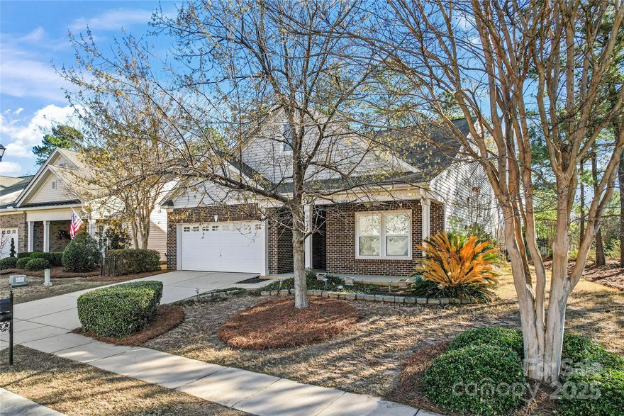 Desirable Grayrock section of Lake Ridge. HOA includes cutting grass and some landscaping. HOA also includes a clubhouse, splash pool, pool with slide, basketball and tennis courts, walking trails and fitness center. Brick accent open floorplan with split BR layout. Primary Bedroom has attached flex space for office/library/sitting room. Primary bath has garden tub with jets and oversized shower stall, double vanity and walk-in closet. 6 panel doors, crown moldings and solid surface counter tops. Rear screened porch and patio. Black aluminum fenced rear yard. This home is in Tega Cay city limits. Tega Cay city provides water, sewer and trash pick up. York County collects property taxes including Tega Cay city taxes. Catawba Park only minutes away.