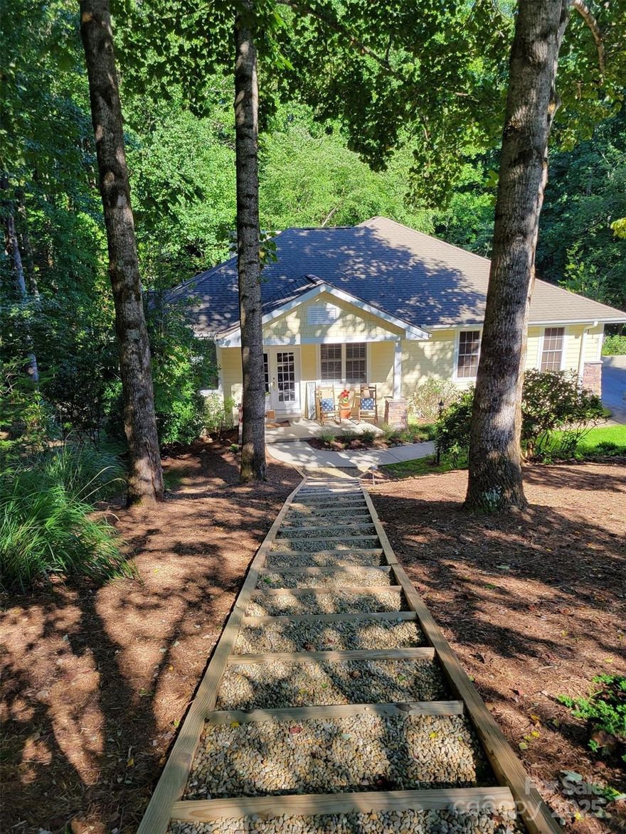 Beautifully kept home situated on cul-de-sac on private lot surrounded by nature. This property has been a part-time home by both homeowners. It has been meticulously maintained and current owners worked very hard to beautify the outside surrounding area of the home. A front walkway up to the street was added, trees close to home were removed, the complete yard was manicured and the backyard was upgraded with new lower level balcony and deck. The ground was raised to create a walk out deck with new grown grass. New LVT flooring was added to the lower level bedroom, family room and office/hobby room making the lower level more cozy and inviting. Main level boasts multiple upgrades including hardwood floors, open floor plan, plantation shutters, and custom blinds. Great room has vaulted ceilings and a floor to ceiling stone gas fireplace. Primary suite is spacious with access to deck and sunroom. Crawlspace is encapsulated including dehumidifier and radon system.