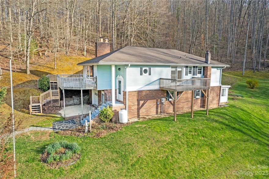 Back on the market with a new Septic tank.  Be the first to get your offer in on this beautiful home with 9.92 acres to create your own mini-farm, hiking trails, or even a little tree house in the woods.  This spacious home has a living/dining room, kitchen, 3 bedrooms and 2 baths on the main level with a beautiful living area on the lower level including bonus room, bath, living room, and a sunroom. Enjoy outdoor entertaining on a large deck with views of the beautiful mountains.  On this magnificent spread, you will also find a two story barn with attached shed and an awesome metal building that could serve as a garage/workshop/studio.  Create your own mini farm on the acreage or just enjoy your own slice of woodlands and beautiful green pastures. Finally, you have to know about the convenience of being only 8 minutes from Weaverville, 20 minutes from Asheville, and 8 minutes from Mars Hill.  

Being an estate the deed will be a Special Warranty Deed.