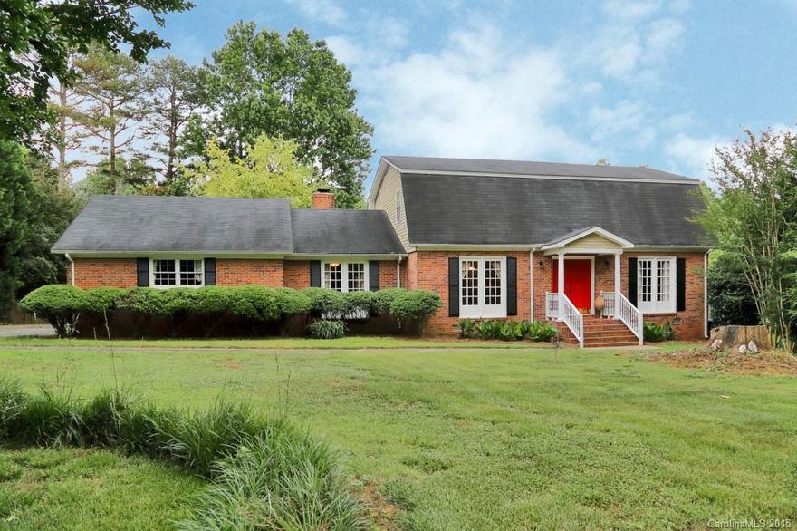 Charming, spacious brick home on beautiful 1 acre lot. Open floor plan with gorgeous hardwoods on main level, updated kitchen with quartz countertops & stainless steel appliances & big pantry. Large living room with beautiful wood burning fireplace. Bedroom & full bath on main level. Huge master with walk-in closet. Side load garage with separate workshop and new garage door. Heated & cooled sunroom overlooking large, private, fenced-in yard with huge deck & in-ground pool perfect for summer fun