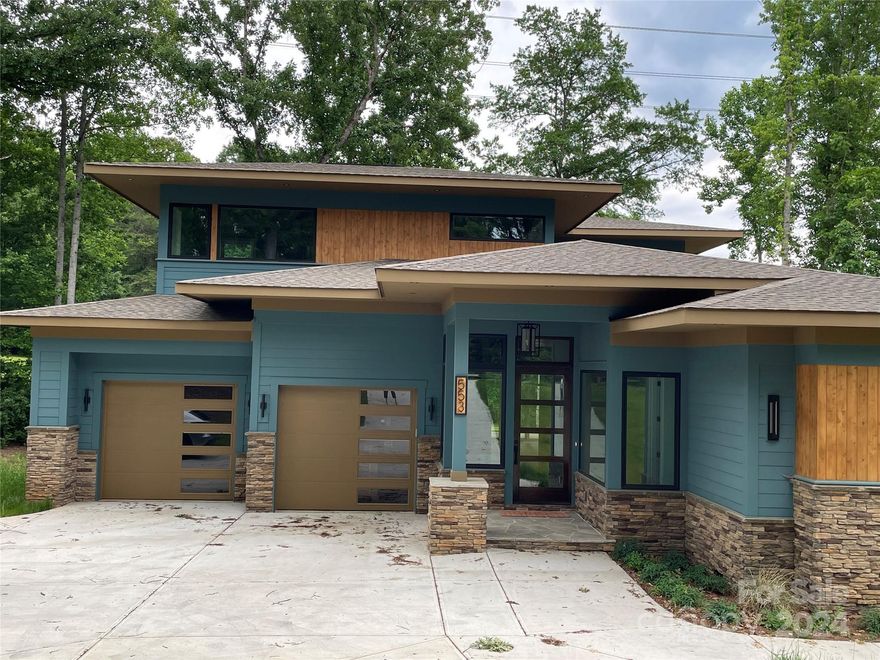 Back on Market at no fault of seller! Come and view this private Lake Wylie custom home located 2 miles from Boyd Bridge.  Situated on a 1.47 acre lot, with direct access to over 500 ft of newly renovated shoreline. Enjoy amazing sunrises over the water from your new home, with multiple views of the lake. Stroll out the back door onto the deck, or wander down to the water to enjoy the beach area or private dock for your boat. This home has been carefully engineered and constructed for a relaxing lifestyle. Open floor plan with primary suite on main, and office/guest bedroom with full bath.  Great room and dining area open to spacious wrap-around rear deck. Chef's kitchen with large center island, custom cabinetry and high end appliances. Large laundry room with drop zone, and oversized 3 car garage with additional driveway parking. Upstairs features 3 more bedrooms, deck and huge bonus room for movie night or workout space. Custom features & fixtures throughout, must be seen!