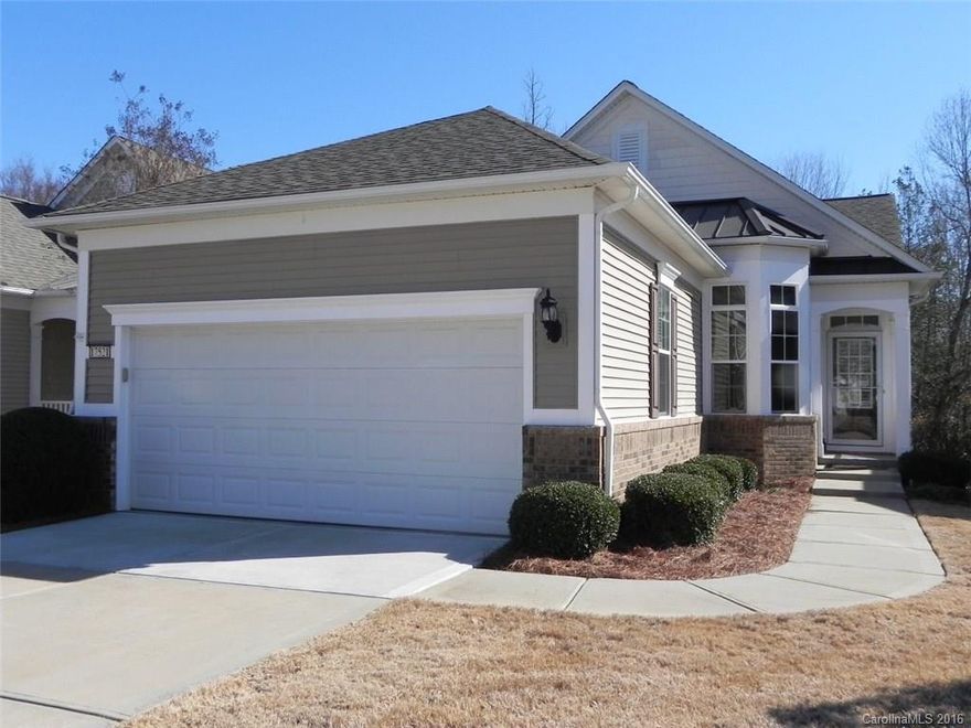 This upgraded Gray Myst w/sunroom has a full finished basement overlooking the woods behind.  The maintenance free deck stretches across the full back of the home with an electric awning.  The living area boasts Brazilian cherry flooring, crown molding, plantation shutters, custom closets and the kitchen has upgraded cabinetry, stainless appliances and much more.  Come check out the community and the active adult lifestyle of Sun City Carolina Lakes.