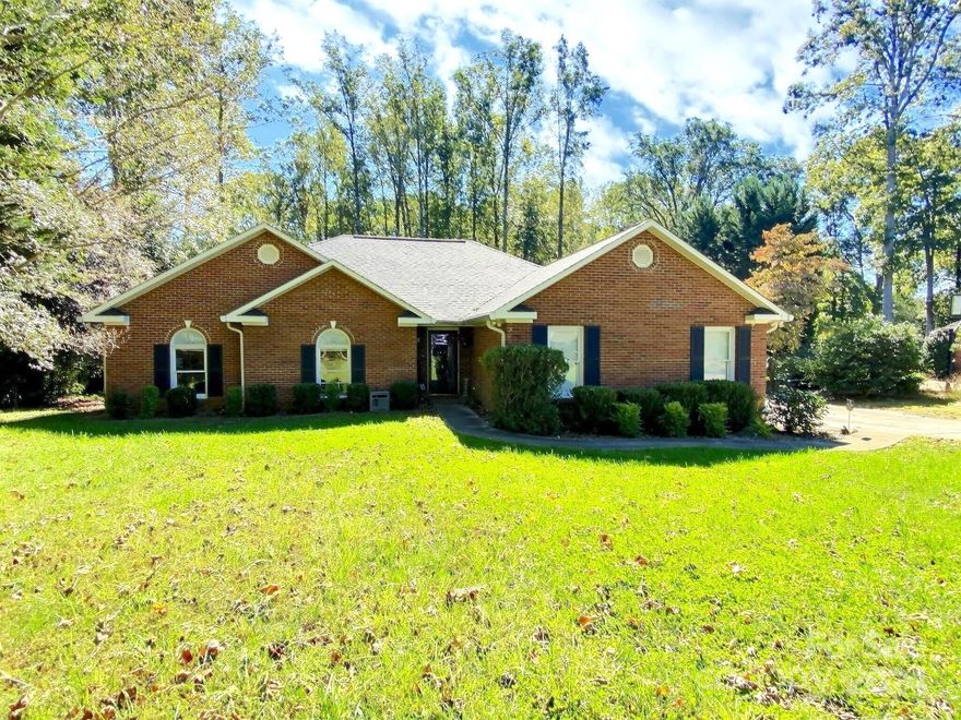 FALL in LOVE with this beautiful full brick ranch in sought-after Cameron Heights! Gourmet kitchen boasts stainless steel appliances, double oven, stunning quartz countertops; perfect for entertaining. Open floor-plan w/ wood floors & cozy gas fireplace. Primary suite is a retreat w/ dual vanities, shower, jacuzzi tub, & expansive walk-in closet. Plus additional bonus room serves as office/gym & conveniently opens to large back deck. Enjoy endless summer fun in the 24ft above-ground pool, or unwind by the added fire pit, all within your beautifully landscaped, tree-lined backyard! Attached 2-car side-load garage is a true bonus, featuring full cabinetry, mini-split AC unit, LED lighting, epoxy floors, upgraded sub-panel & RV receptacle—ideal for any hobbyist/traveler. Additional upgrades is a whole-house water softener system & extended driveway for ample parking. Large lot w/ serene views & ample outdoor space, this home is an entertainer’s dream! Lake Norman only 1 mile away!