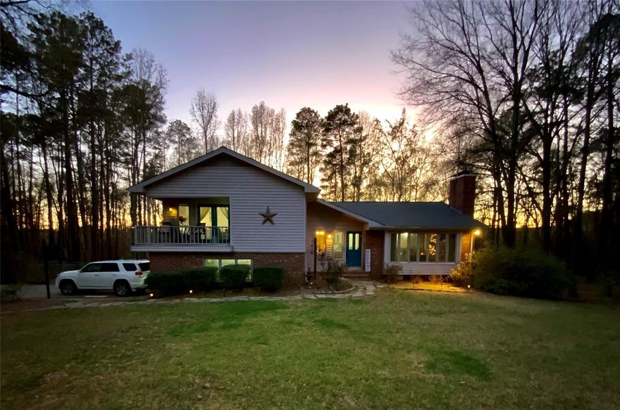 Enjoy country living with all the urban conveniences and NO HOA. The backyard has an above ground pool that is 24ft round x 52" deep. There is a separate fenced area for pets located in the rear corner of the lot. The house has a basement workshop with tons of storage room and access from the backyard. This house has been nicely updated with vinyl plank and laminate flooring, remodeled full bathroom, fresh paint throughout, new toilet in the 1/2 bath, new water heater (2023), the upstairs HVAC unit was replaced in 2021, and new cabinets and appliances (2021) in the kitchen. On a chilly night, you can relax in front of the wood burning fireplace. On a warm night, take it all in from the wrap-around balcony with access from the primary bedroom, or hang out with friends on one of your two screened in porches overlooking the backyard. The lower level has a huge bonus/bedroom with 4 closets and walkout access to the backyard and garage. There are so many possibilities with this space!