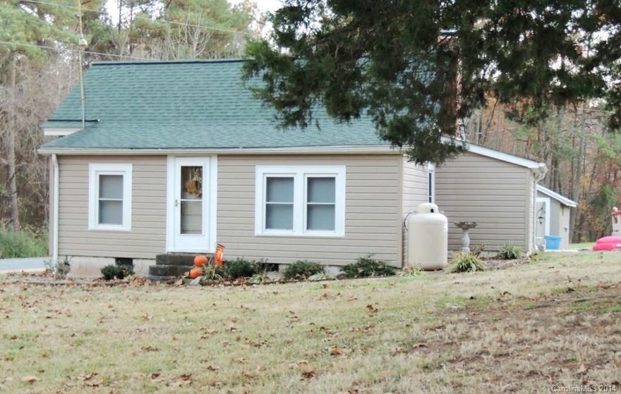 Country cottage that has many updates. Beautiful wood floors and replacement / insulated windows. Workshop / storage building at the property with electricity. Very quiet country setting.