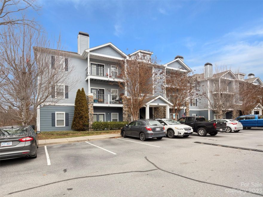 This well appointed spacious unit looks into the woods from every room, with a ground level patio by a walking trail and babbling creek. High ceilings, hardwoods throughout living areas and tile in the baths. Granite counters, stainless steel appliances and upgraded & plentiful cabinets in the kitchen. This hidden gem is one of the larger units in the development offering a 3/2 split bedroom plan. With no adjacent unit, the home sits in a unique spot in the back of the 400 building lending a surprising sense of privacy. Popular community offering exceptional amenities including a pool and onsite car wash station! All at an unbeatable price point, making for a great lifestyle. Nearby tons of shopping, restaurants, breweries, bakeries in Candler and just 10 minutes to West Asheville, 15-20 to downtown!