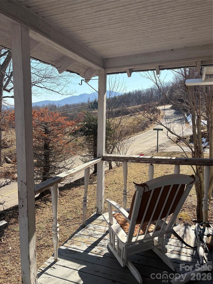 Welcome Home to your Green Mountain retreat!  Investors take notice.  This home is waiting for the updates needed to make it a perfect family home, rental home or vactional rental.  The location is perfect for all that Burnsville offers.  Minutes from town for shopping, dining or a night on the town.  It's also just a short distance from Mount Mitchell State Park, Wolf Laurel Ski Resort, and tons of funs on the Cane and Toe Rivers.  The relaxing front porch offers serenity and beautiful views.  The home has 2 well appointed bedrooms, the primary with an en-siut and an additional full bath for guests.  The open concept for the kitchen and dining area keeps everyone involved for family events.  The living room has amazing windows that let the natural light flow in while offering views of the mountains.  Finally a huge plus is all the building materials in the home remain for future updates or to build the cabin the owners wanted to start.  Home is being sold furnished so move in and let the updates begin!