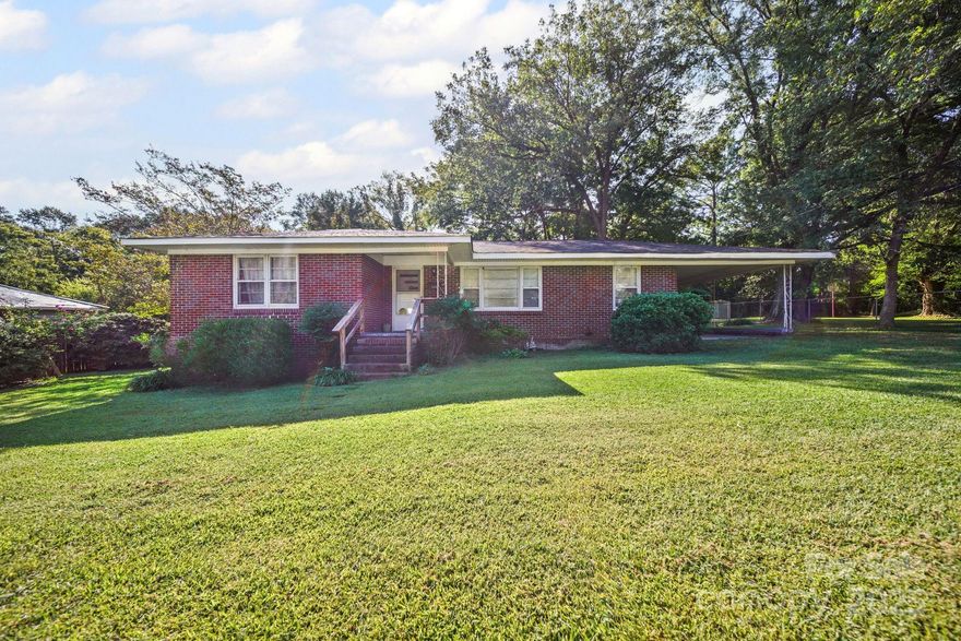 Bring your vision and unlock the potential in this 3-bedroom, 2-bath brick ranch in the heart of Chester! A large living room welcomes you with natural light, while the formal dining room features a cozy fireplace and sliding glass doors that open to the private backyard, perfect for relaxing or entertaining. The primary bedroom offers a full bath, with two additional bedrooms sharing a second full bath.

This home also features hardwood floors that just need a little love to truly shine. A covered carport provides convenient parking, and the home’s quiet setting offers privacy while still being close to town. Solid, full of charm, and ready for your updates and personal touch. This is a great opportunity to create the space you’ve been envisioning! Home is being sold as is, where is.